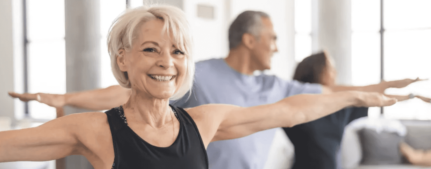 Elder Woman smiling in the gymnastic