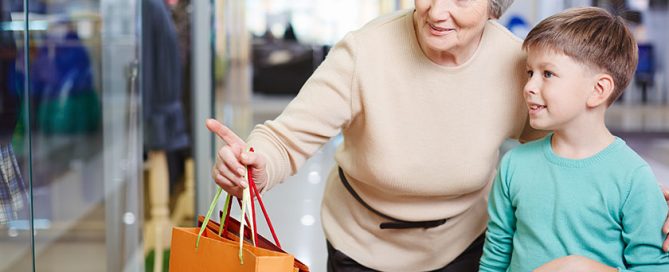 Child and his grandmother with paperbags