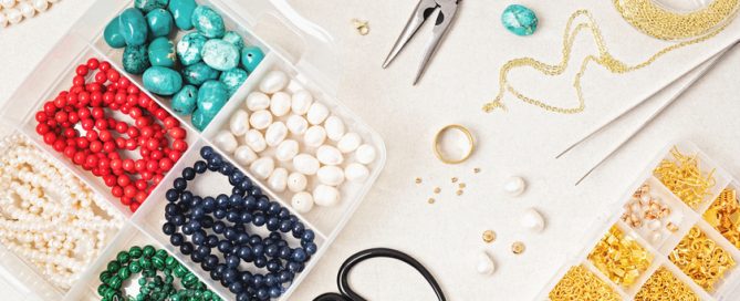 Jewelry making flatlay with semi-precious stone beads and tools